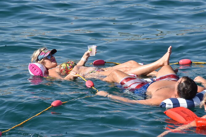 All Inclusive Cabo Boat Tour: Snorkeling, Food, and Drinks - Lover’s Beach and Divorce Beach show two sides of the coast