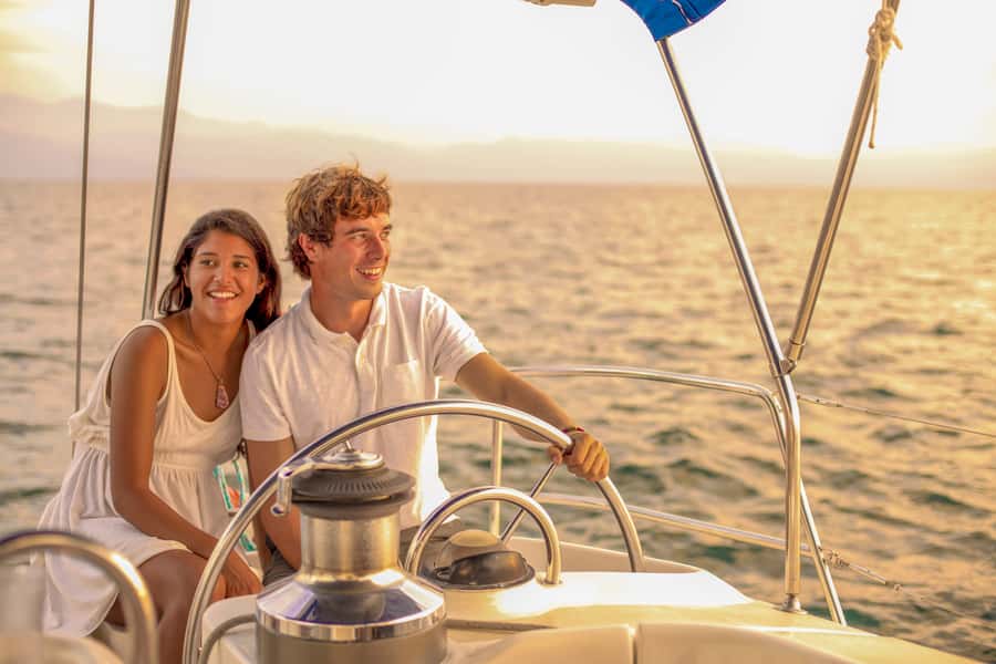 Cabo Luxury Sunset Sailing Adventure with Open Bar - Following the shoreline toward the old lighthouse