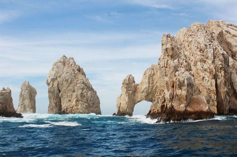 From Cabo San Lucas: Lovers Beach and El Arco Boat Trip - Crossing Cabo’s rock formations by glass-bottom boat