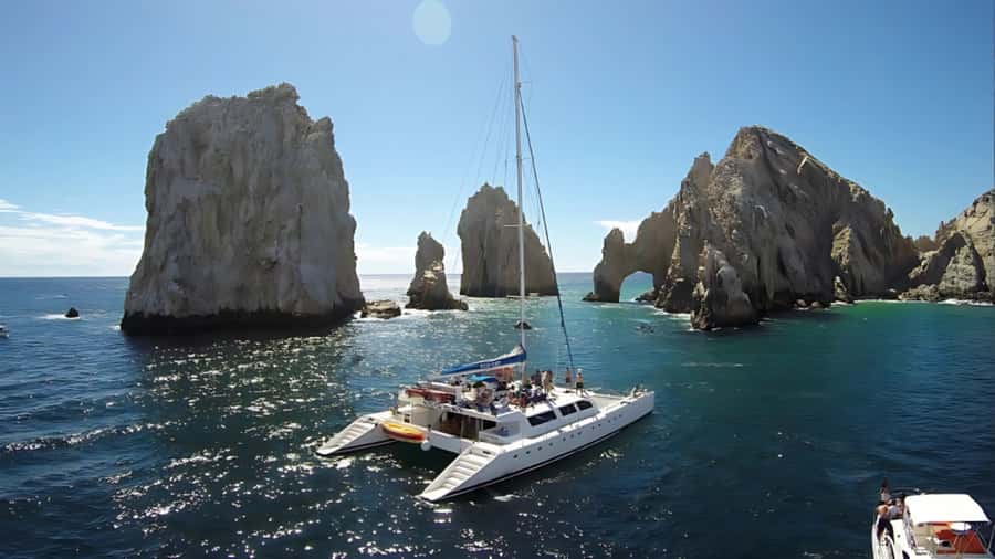 Los Cabos Catamaran: Iconic Sunset Cruise with Drinks & DJ - What the cruise atmosphere is likely to feel like